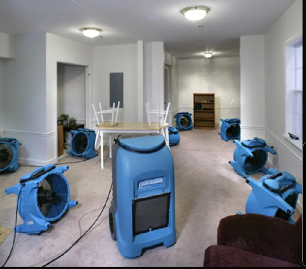 Air movers and dehumidifier setup for Water Damage Restoration in Mendon