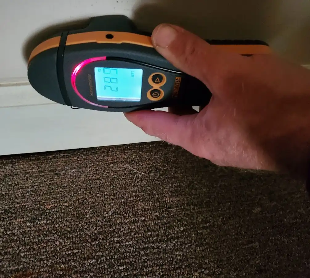 Moisture detection at baseboard during Storm Damage Restoration in Mendon